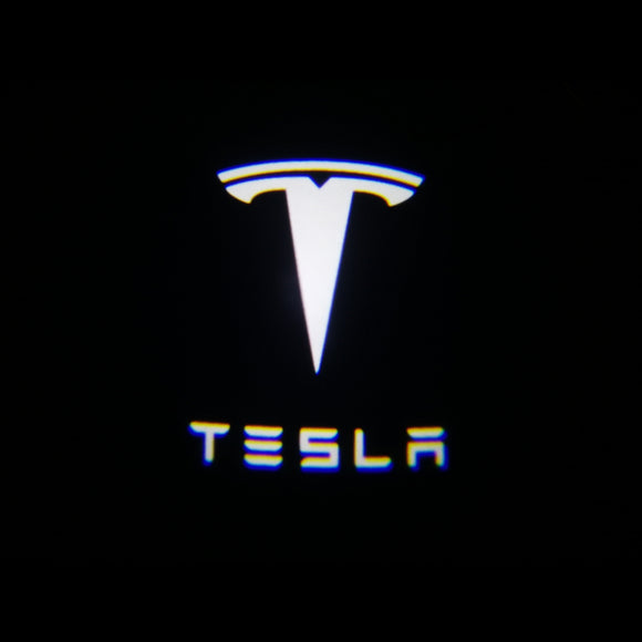 Tesla puddle light logo on a black background