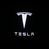 Tesla puddle light logo on a black background