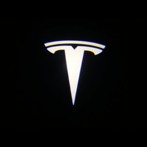 Tesla door light logo projected on a black background