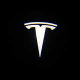 Tesla door light logo projected on a black background